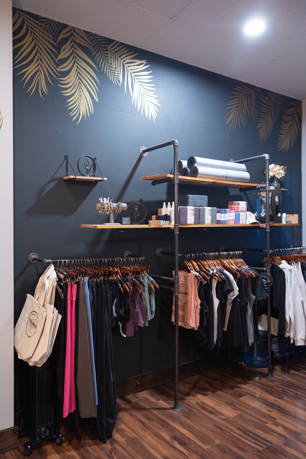Triumph Studio’s current retail display with apparel and accessories